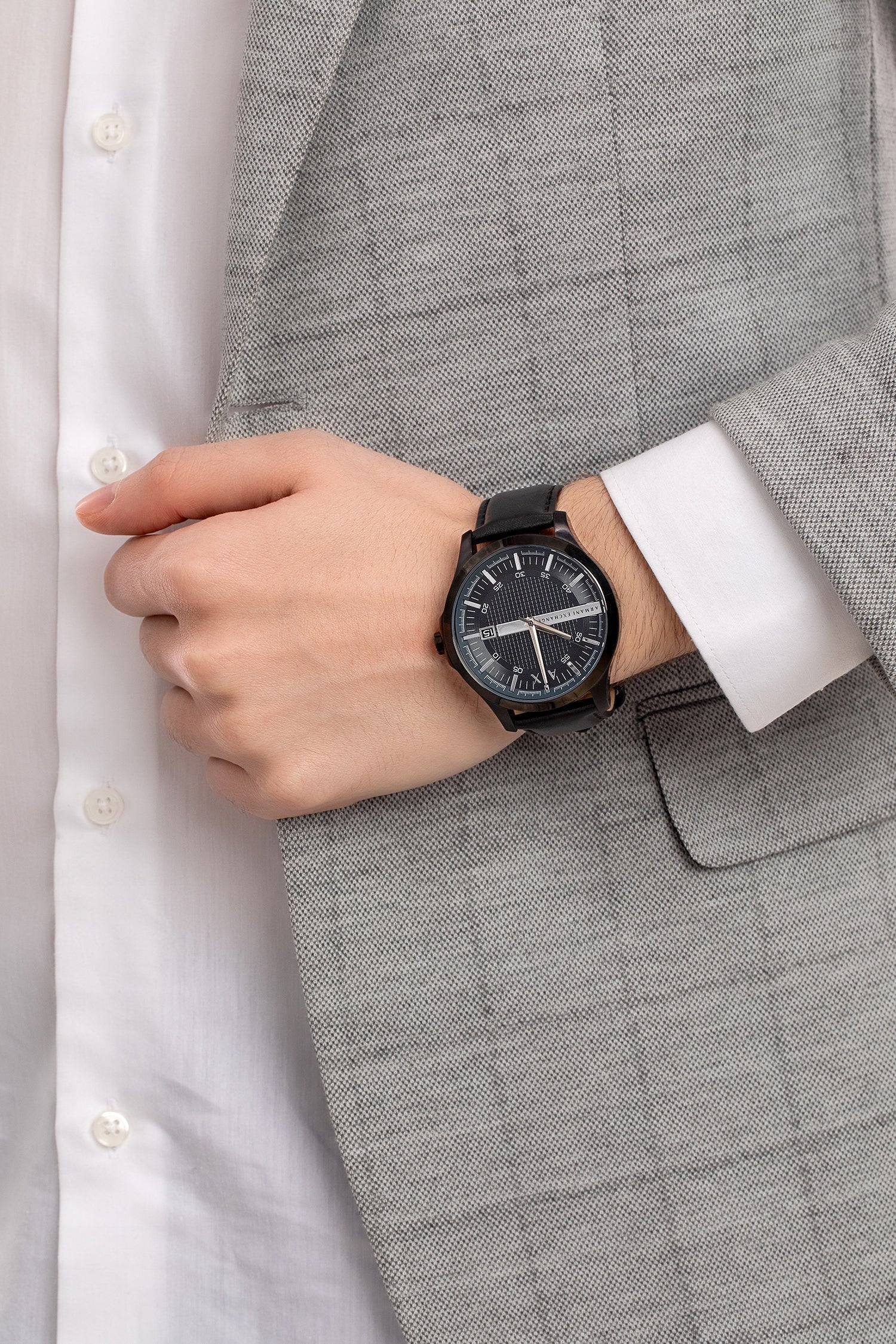 Armani Exchange Hampton AX2411 watch worn on wrist with grey suit