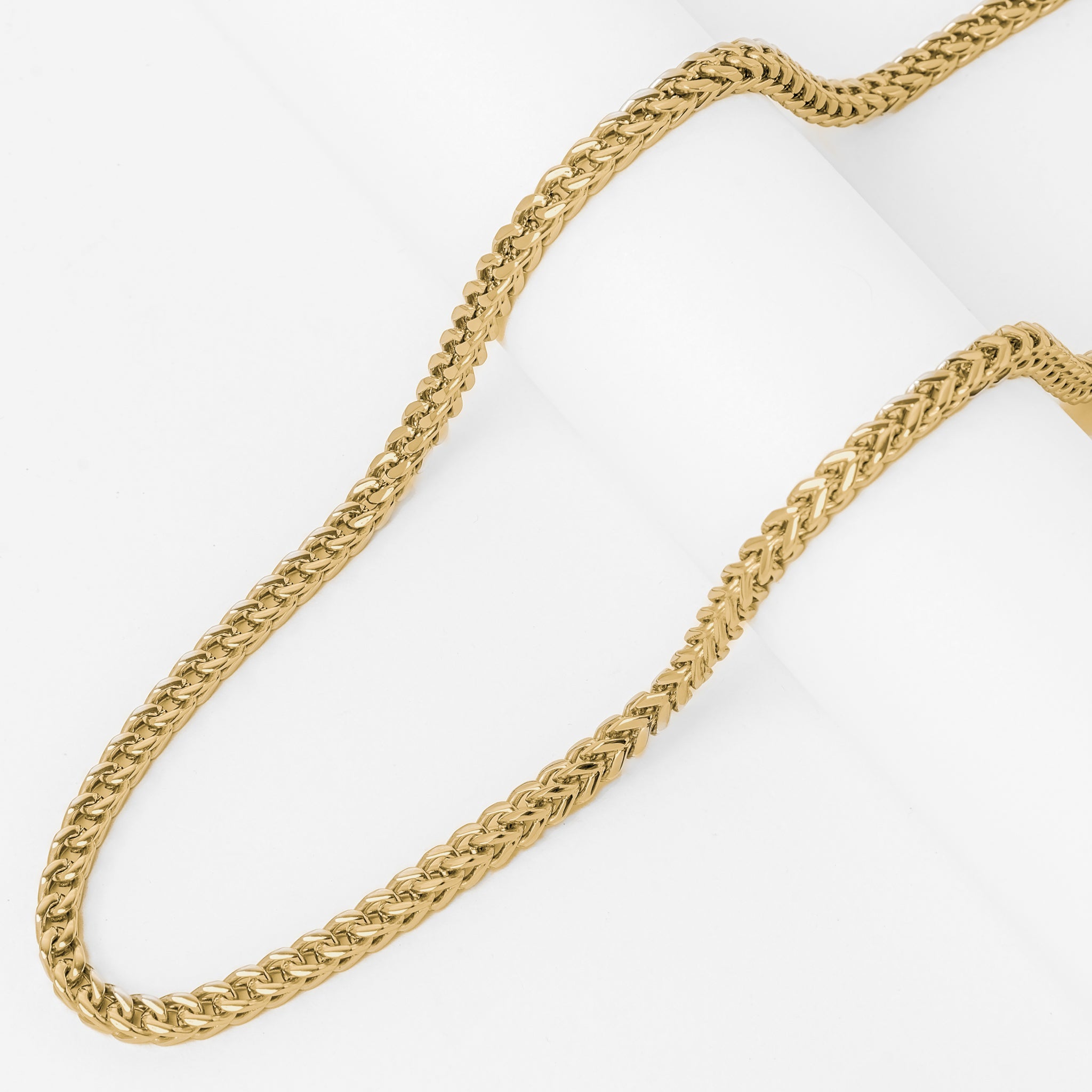 Gold rope chain texture and weave detail close-up