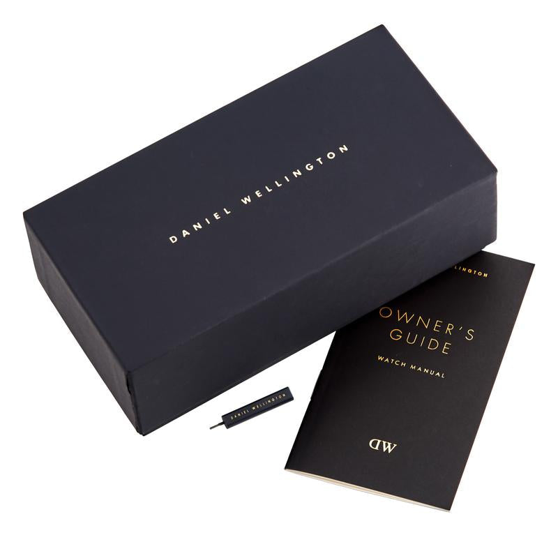 Daniel Wellington branded packaging with York watch, owner's guide manual, and leather strap