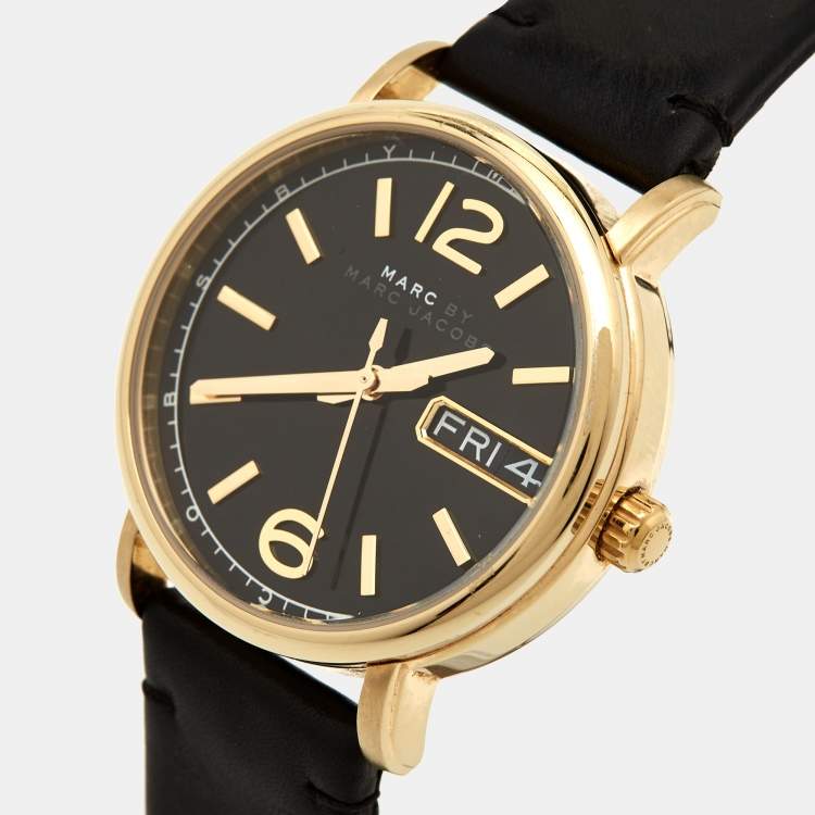 Marc by Marc Jacobs MBM8651 watch at angle showing gold case, black dial with gold indices, and day-date window