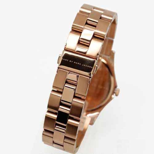 Side view of Marc by Marc Jacobs Henry gold stainless steel three-link bracelet with brand engraving