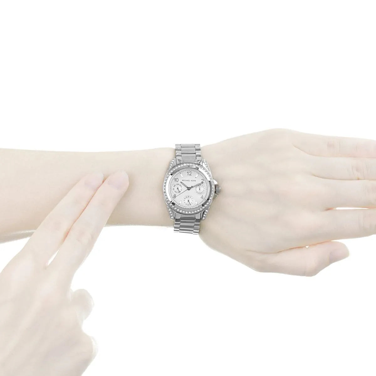 Michael Kors Blair watch worn on wrist showing silver-tone case and crystal bezel details