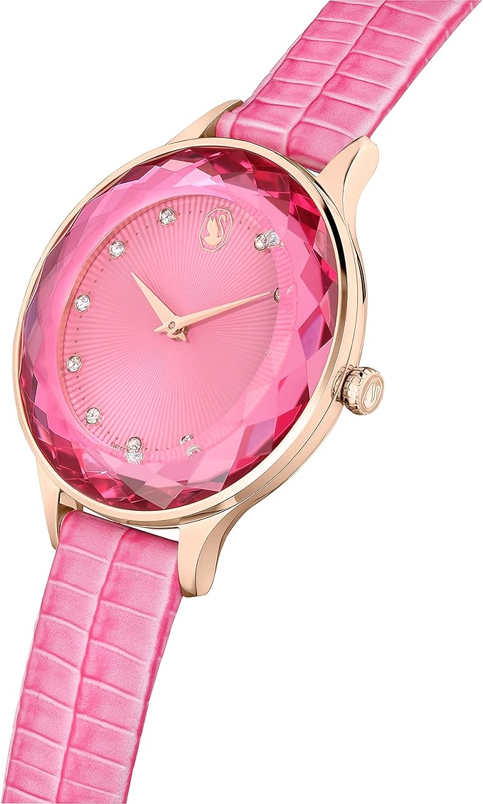 Swarovski Octea Nova watch on wrist showing pink crocodile-embossed leather strap