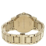 Burberry esfera blanca reloj unisex de acero inoxidable chapado en oro amarillo BU9003