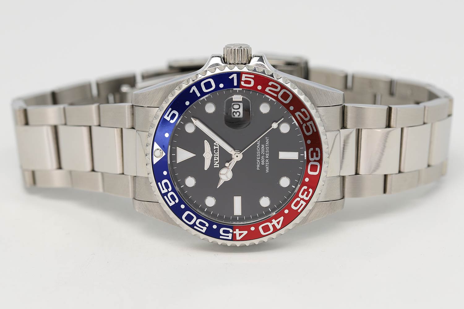 Invicta Pro Diver watch angled view showing steel bracelet and Pepsi bezel