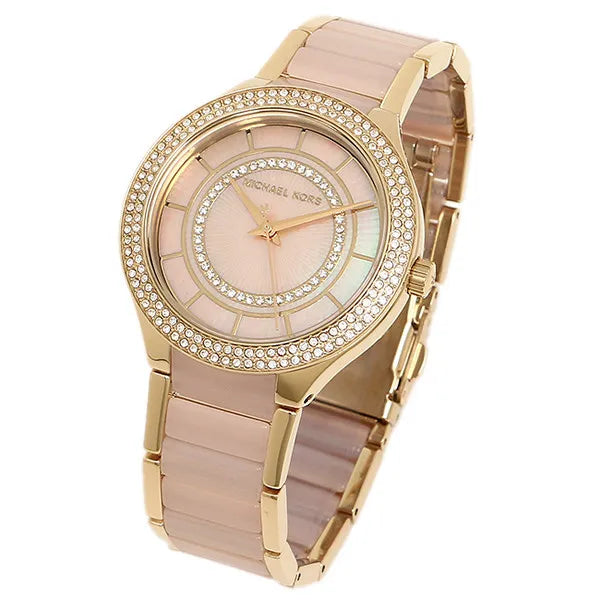 Michael Kors Kerry MK3508 angled view of pink dial, crystal-set bezel, and gold-acetate bracelet