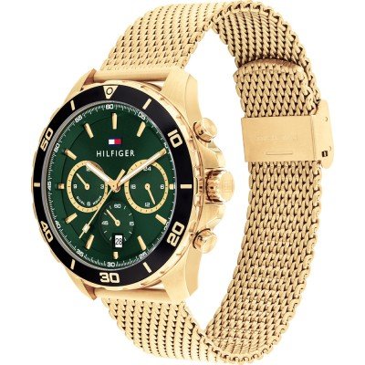 Angled view of Tommy Hilfiger gold watch showing green dial and gold mesh bracelet detail